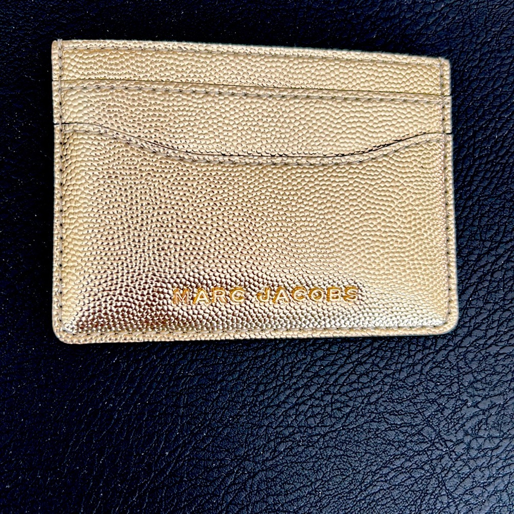 Marc Jacobs card case in gold.
